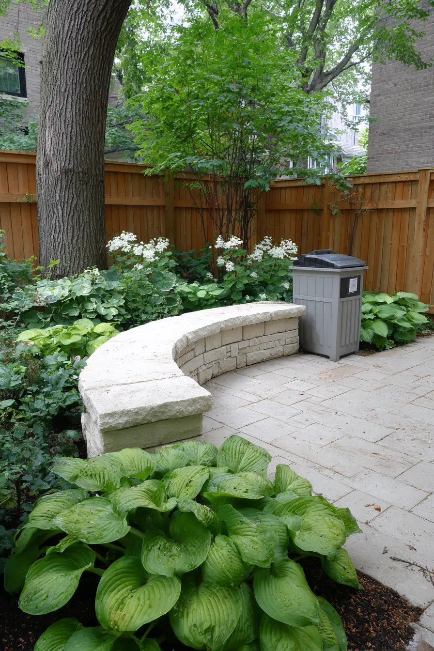Curved Stone Bench Surrounded by Hosta