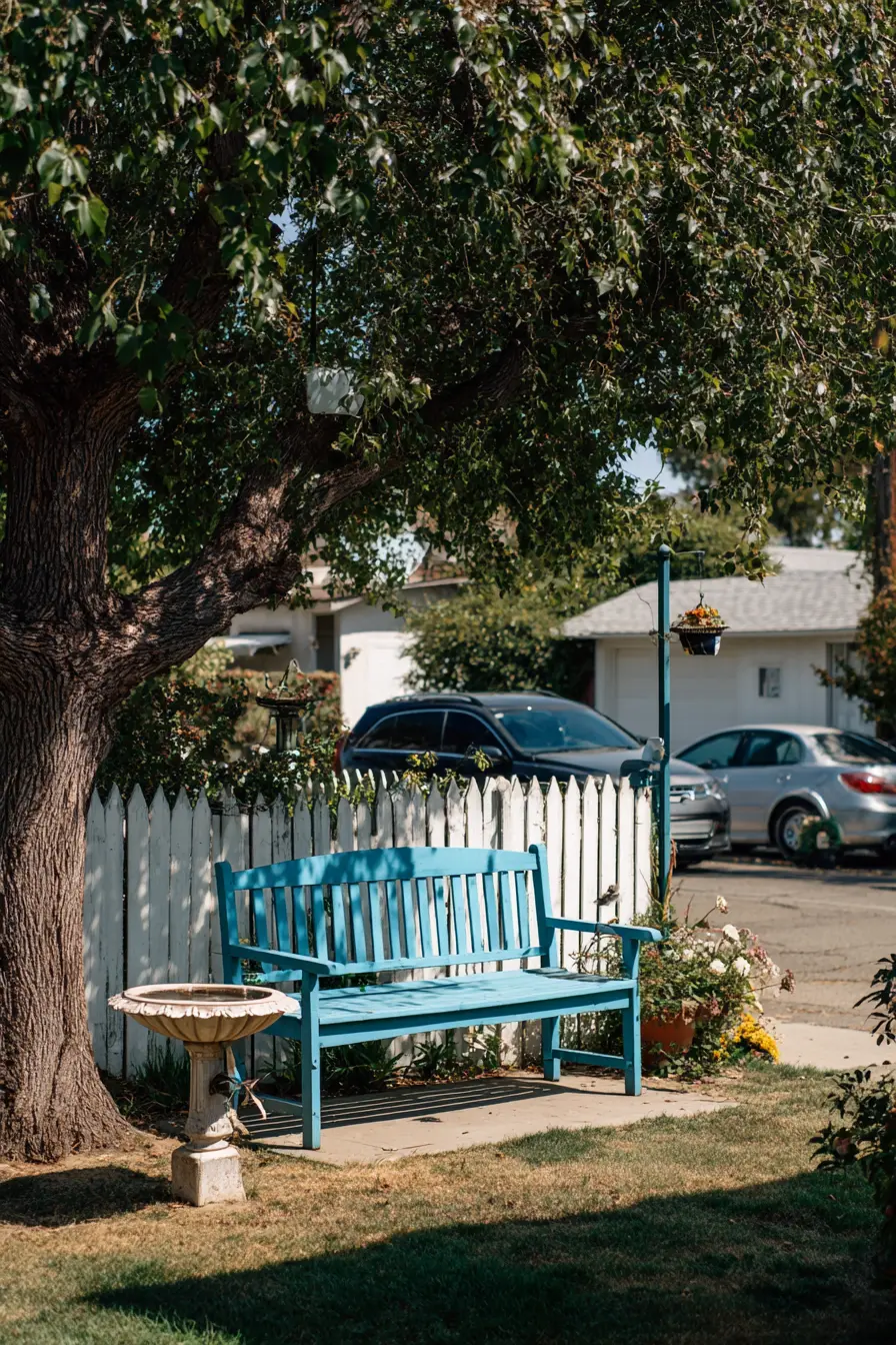 Charming Blue Bench Under Canopy Trees
